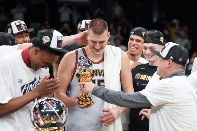 Nuggets center Nikola Jokic celebrates winning the Western Conference MVP trophy and beating the Los Angeles Lakers.